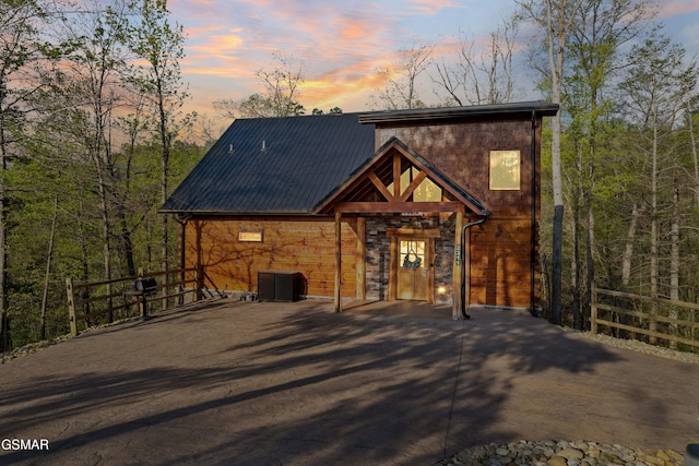 2311 Wild Heron Way, Sevierville, TN 37862 - chalet / cabin with metal roof, stone siding, and central air condition unit