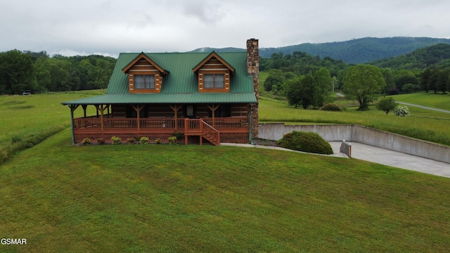 2597 Rutledge Pike, Blaine, TN 37709 - log home with a porch, a chimney, a front yard, and metal roof