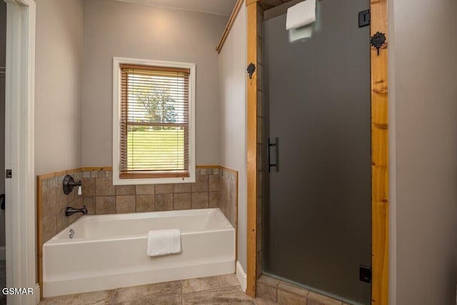 bathroom featuring tile patterned floors and plus walk in shower