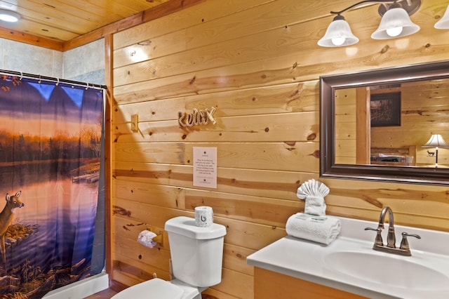 bathroom featuring vanity, wood walls, wooden ceiling, a shower with shower curtain, and toilet