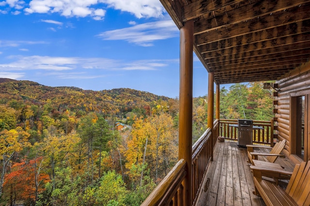 deck featuring a mountain view and grilling area