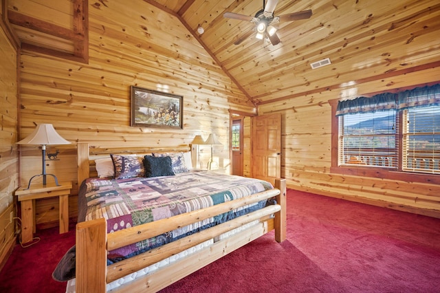 bedroom with multiple windows, ceiling fan, wooden ceiling, and wood walls