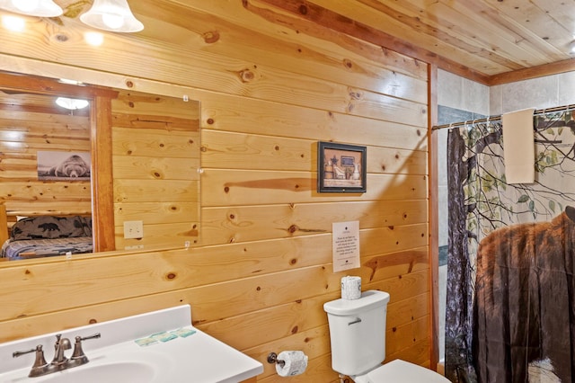 bathroom featuring a shower with curtain, toilet, wooden ceiling, and wood walls