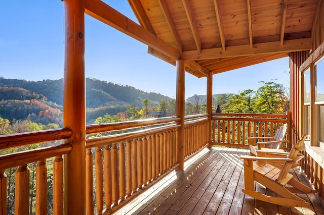 wooden deck featuring a mountain view