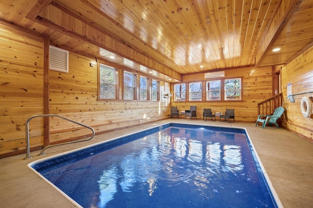 view of pool with a wall mounted air conditioner