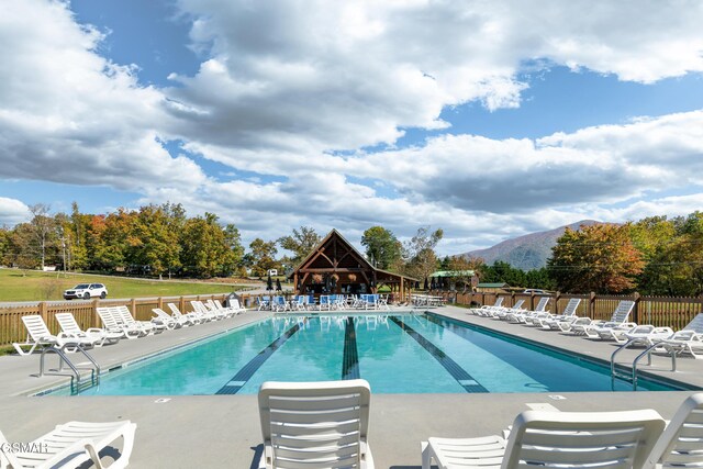 view of swimming pool featuring a mountain view