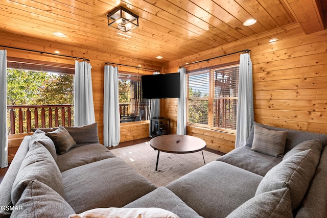 living room with wood ceiling and wood walls