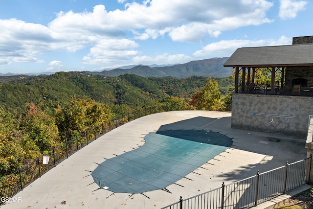 view of pool featuring a mountain view and a gazebo