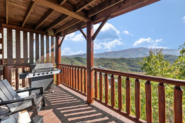 deck featuring a mountain view and area for grilling