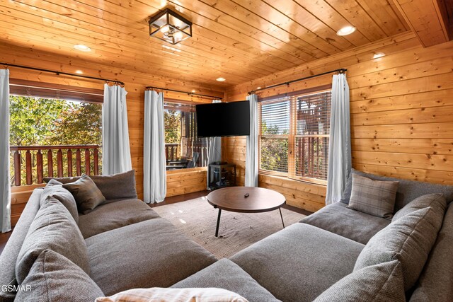 living room with wood walls and wood ceiling