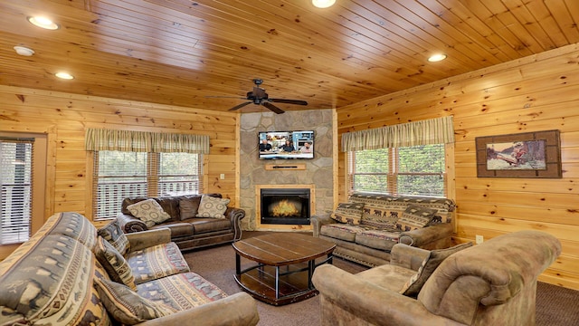 carpeted living room featuring wooden ceiling, plenty of natural light, and wooden walls