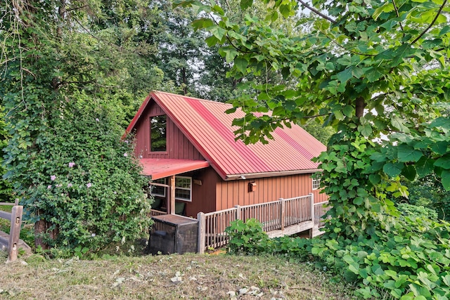 view of property exterior featuring a wooden deck