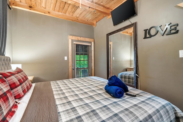 bedroom featuring beam ceiling and wood ceiling