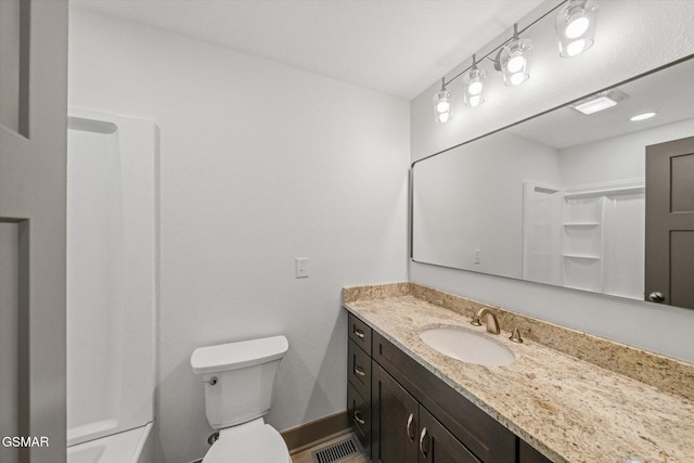 full bathroom with visible vents, toilet, vanity, baseboards, and walk in shower