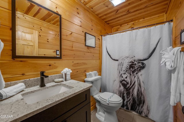 bathroom featuring toilet, wooden walls, wooden ceiling, tile patterned floors, and vanity