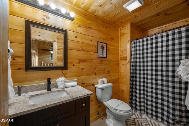 bathroom featuring toilet, vanity, tile patterned floors, wooden walls, and wood ceiling