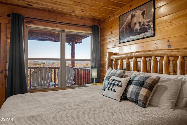 bedroom with wood ceiling and wood walls