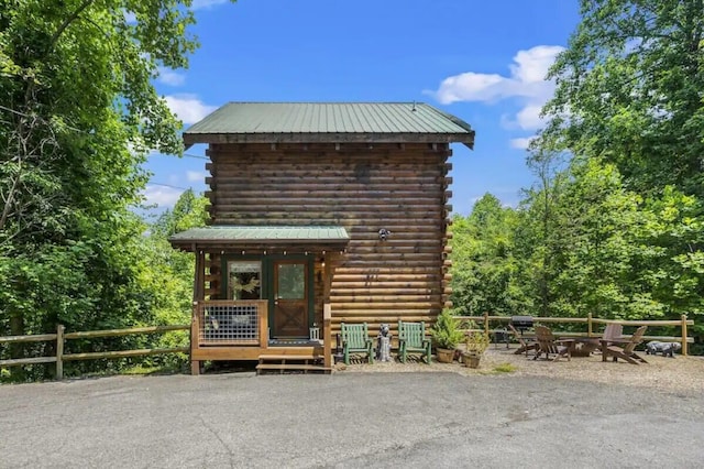 view of outbuilding with a fire pit