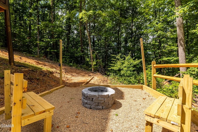 view of yard with a fire pit