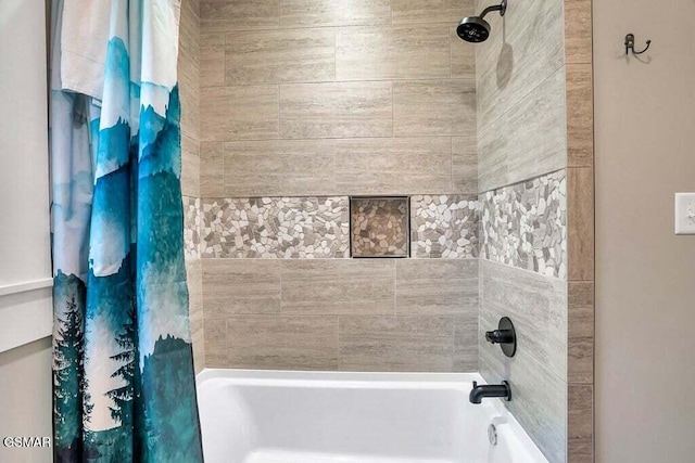 bathroom with shower / bath combo with shower curtain