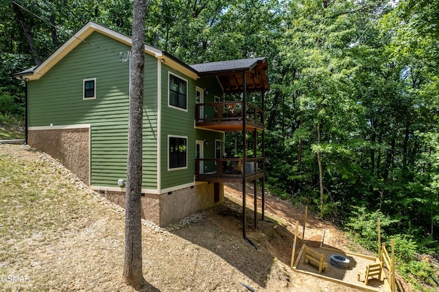 view of side of home featuring a deck