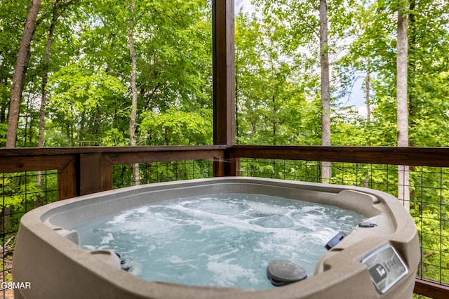 wooden terrace with a hot tub