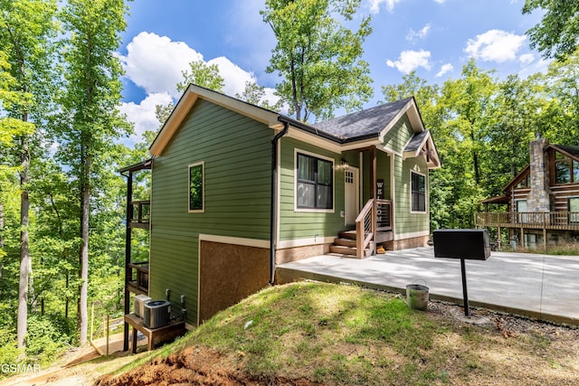 view of front of house featuring a patio area and central air condition unit