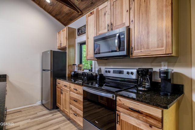 kitchen featuring lofted ceiling, dark stone countertops, light hardwood / wood-style floors, wood ceiling, and stainless steel appliances