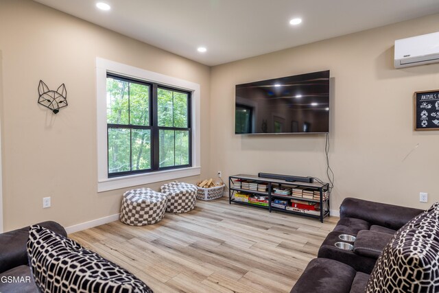 living room with light wood-type flooring and a wall mounted AC