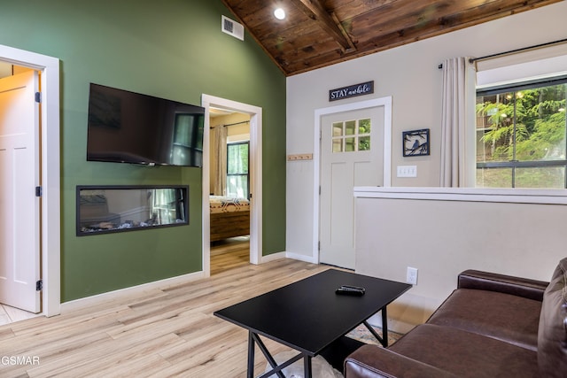 living room featuring light wood-type flooring, lofted ceiling with beams, and wood ceiling