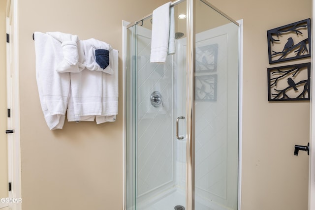 bathroom featuring an enclosed shower