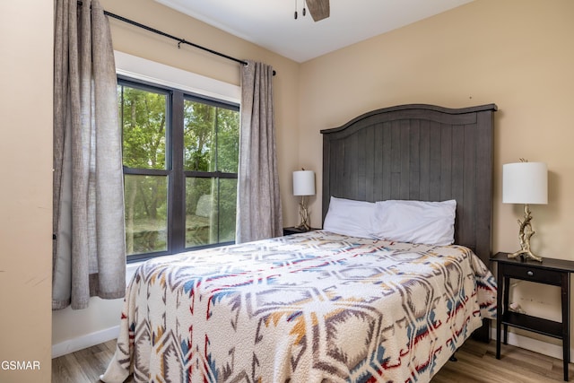 bedroom with ceiling fan and hardwood / wood-style floors