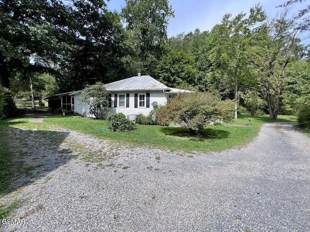 view of home's exterior with a lawn