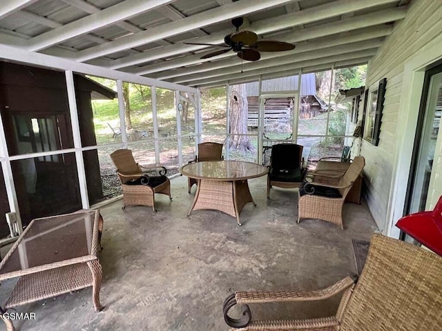 sunroom featuring vaulted ceiling