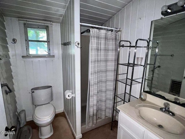 bathroom with a shower with curtain, vanity, toilet, and wooden walls