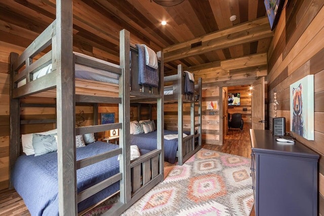 bedroom featuring wooden walls and wooden ceiling