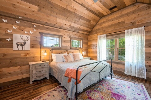 bedroom with wood walls, wooden ceiling, dark wood-type flooring, and vaulted ceiling