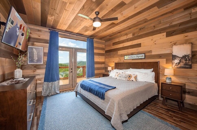 bedroom featuring wooden ceiling, wooden walls, ceiling fan, dark hardwood / wood-style floors, and access to exterior