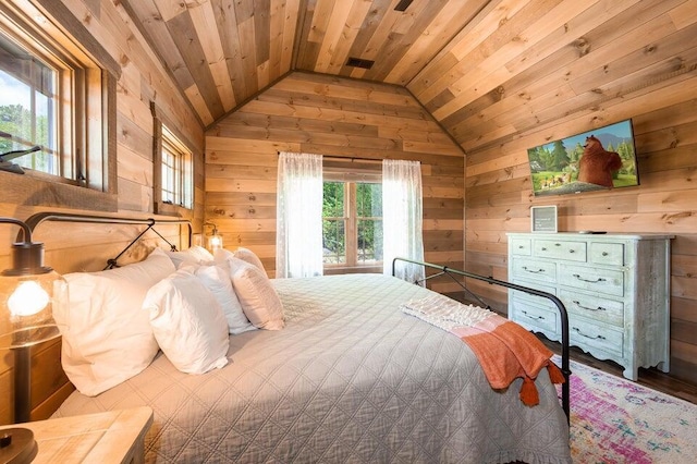 bedroom with wooden walls, wooden ceiling, and lofted ceiling