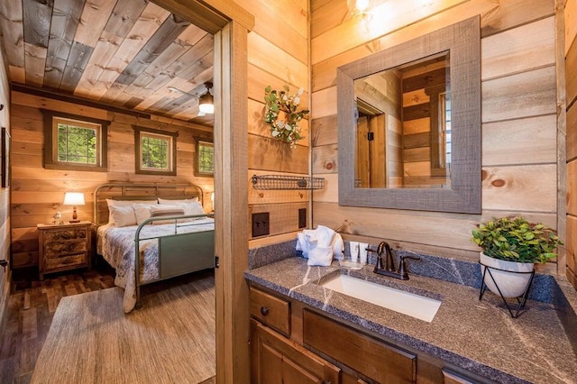 bathroom with wood walls, vanity, wooden ceiling, and hardwood / wood-style flooring