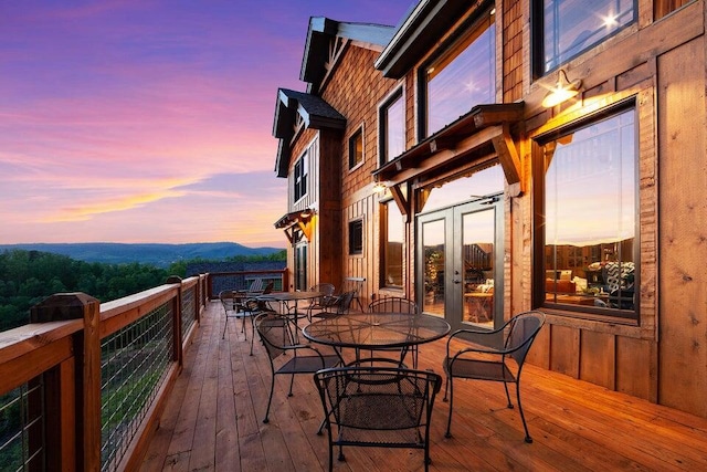 deck at dusk with a mountain view