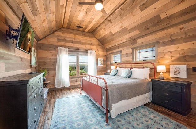 bedroom featuring lofted ceiling, dark wood-type flooring, wood walls, and wood ceiling