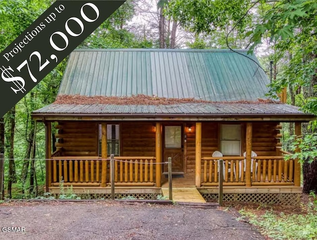 log cabin with covered porch