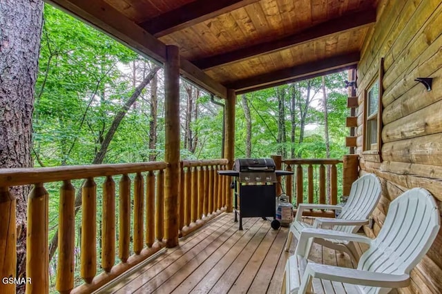 wooden deck featuring area for grilling