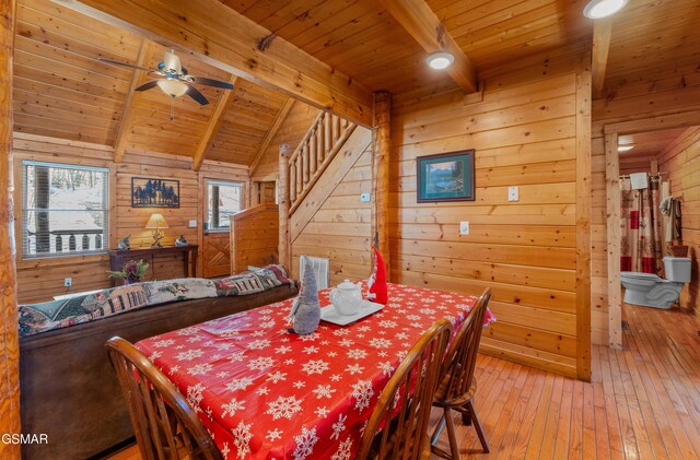 bathroom featuring hardwood / wood-style floors, wood walls, wooden ceiling, a shower with shower curtain, and vanity