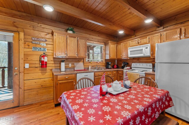 bedroom featuring wooden ceiling, ceiling fan, wooden walls, and beamed ceiling