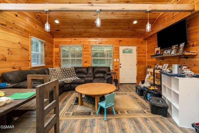 living room with hardwood / wood-style floors, lofted ceiling with beams, wood walls, and wood ceiling