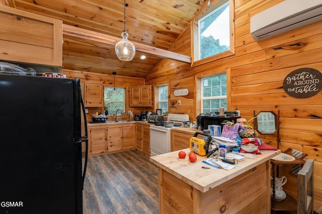 kitchen featuring hanging light fixtures, white electric range, black fridge, an AC wall unit, and vaulted ceiling