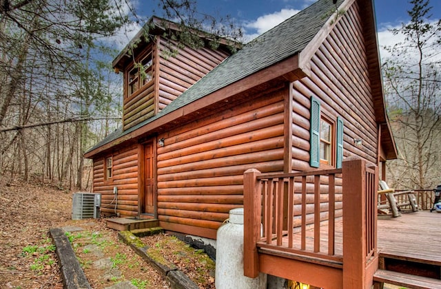 view of home's exterior with central air condition unit and a wooden deck