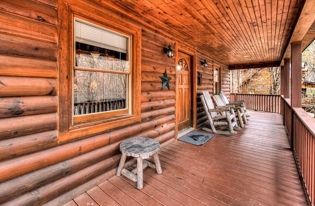 wooden terrace with a porch